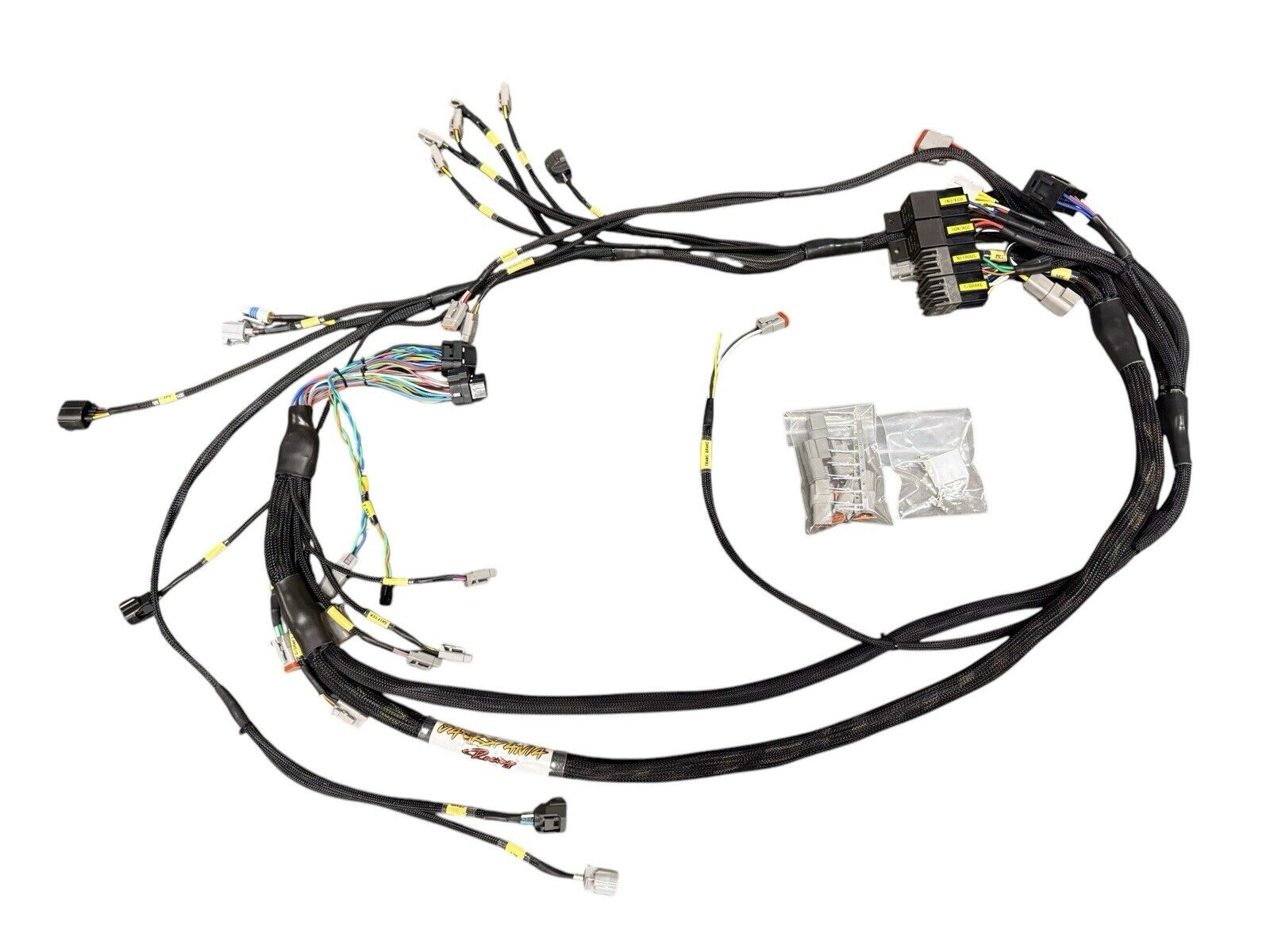 Engine wiring harness for Fueltech FT550 and 2JZ VVTi from JackSpania Racing, showing detailed electrical connectors and wiring.