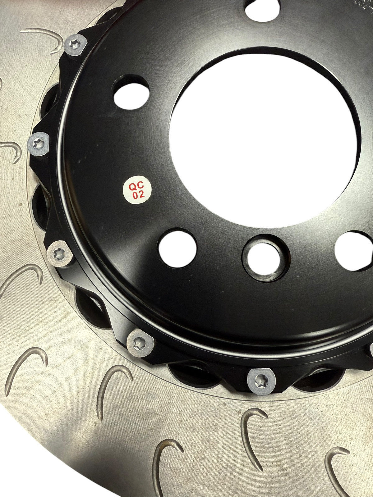 Big brake kit with drilled rotors and 4-piston calipers for BMW E46, by JackSpania Racing, interior view showing brake components.