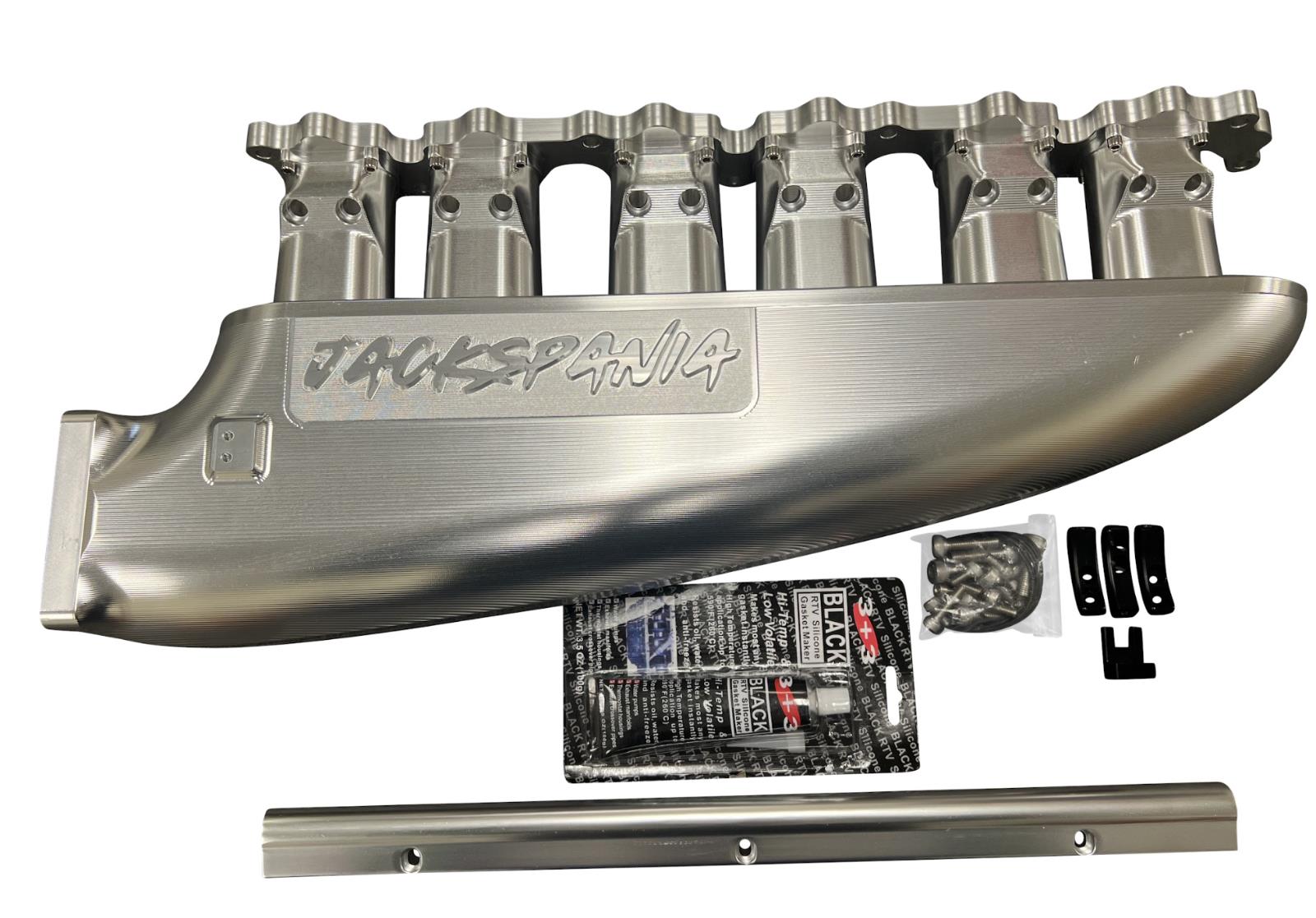 JackSpania Racing 2JZGE intake manifold with 12 injector fuel rail and throttle body for engine performance enhancement.