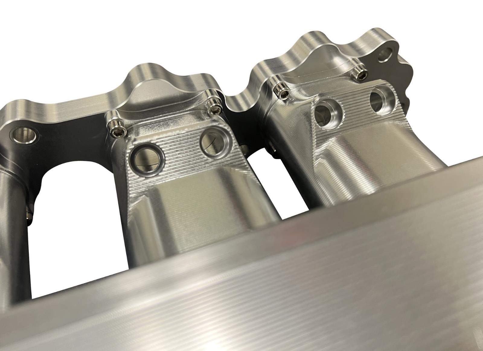 JackSpania Racing 2JZGE intake manifold with 12 injector fuel rail and throttle body for engine performance enhancement.
