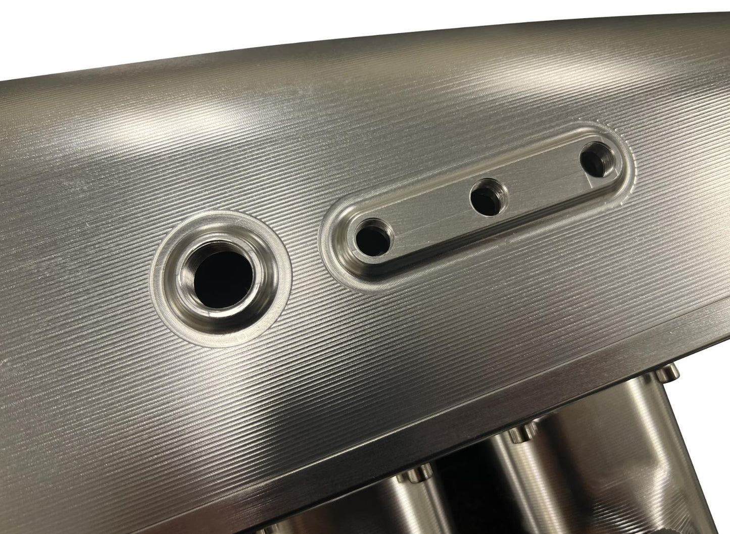 JackSpania Racing 2JZGE intake manifold with 12 injector fuel rail and throttle body for engine performance enhancement.