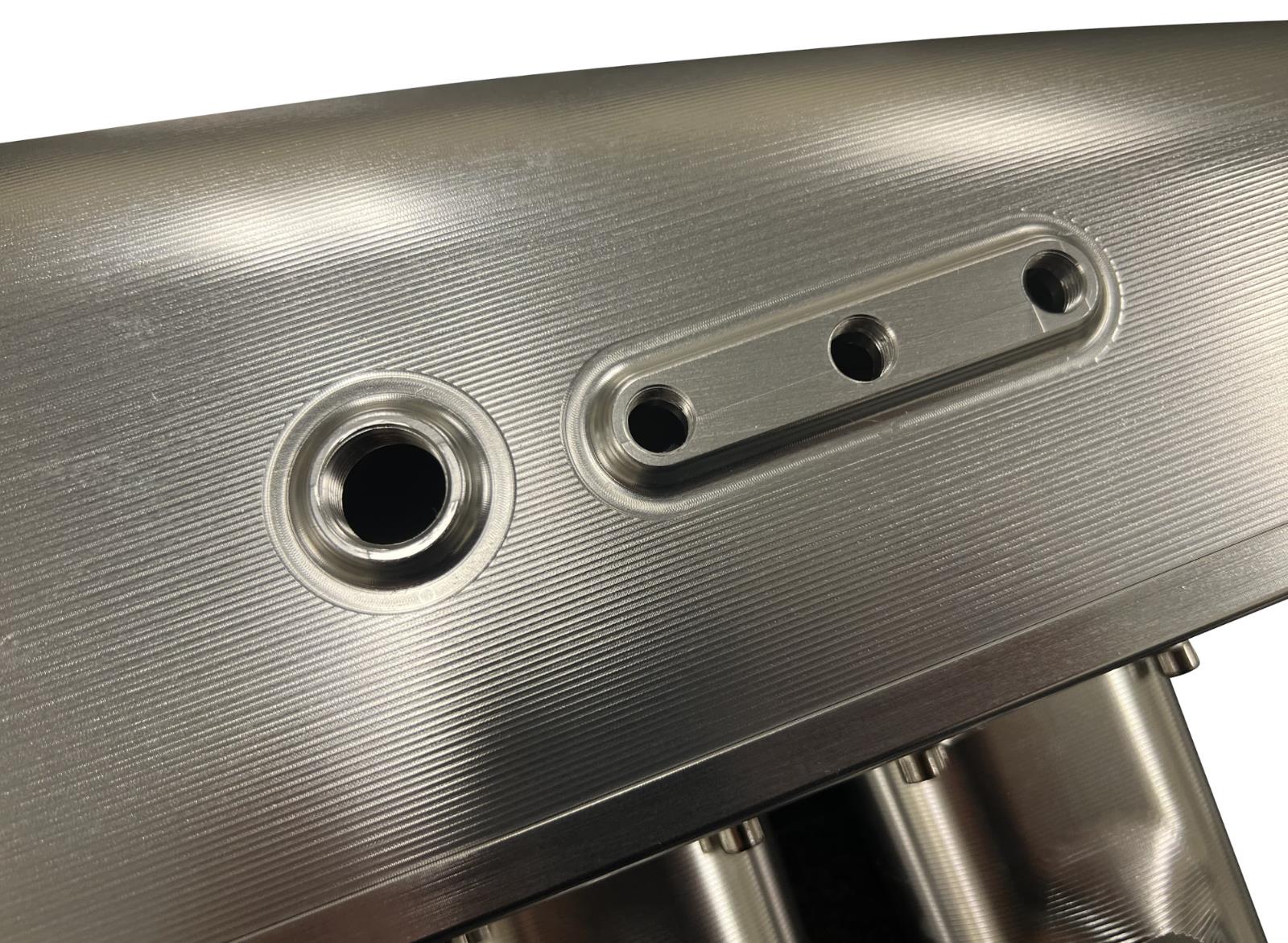 JackSpania Racing 2JZGE intake manifold with 12 injector fuel rail and throttle body for engine performance enhancement.