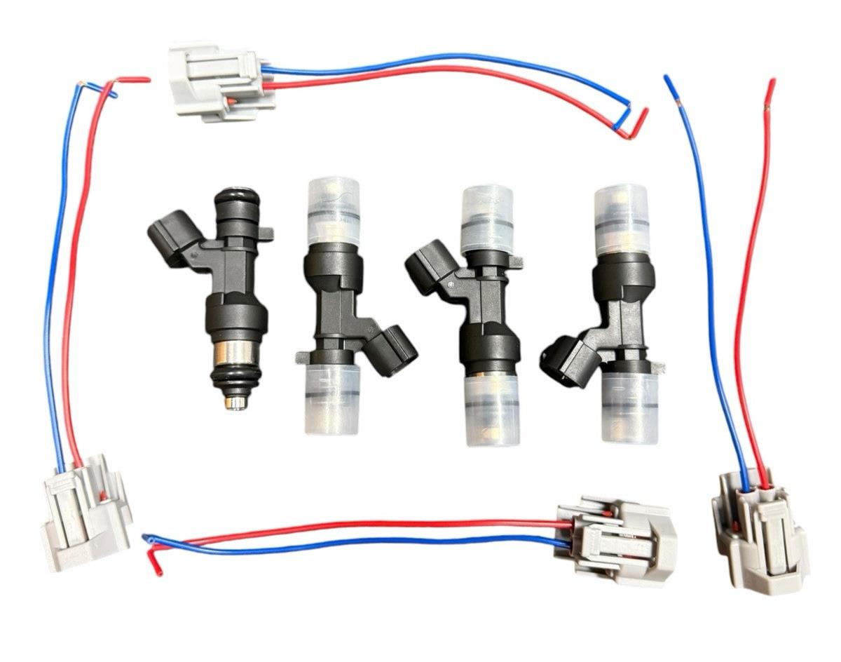Set of four 1200cc K Series K20 K24 fuel injectors for Honda and Acura engines, by JackSpania Racing, shown in the image.