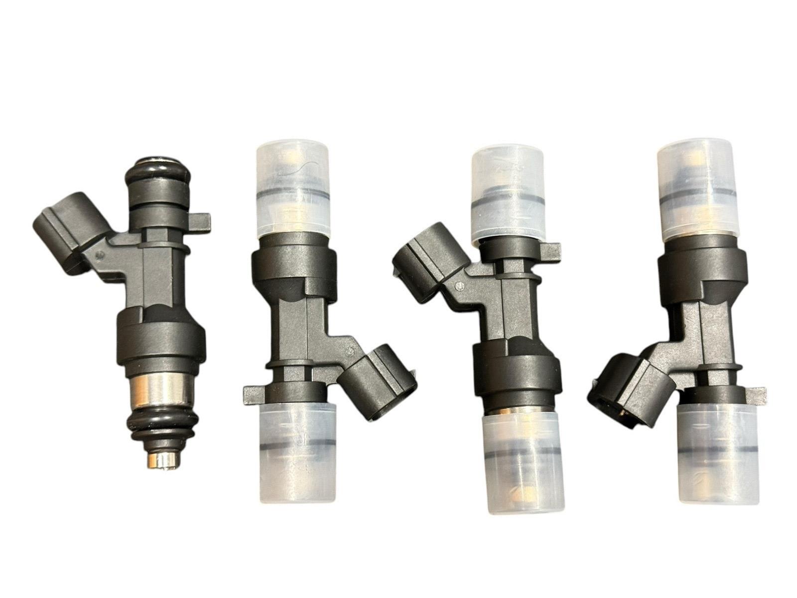 Set of 4 JackSpania Racing K Series K20 K24 flow-matched 1200cc fuel injectors for Honda and Acura engines.