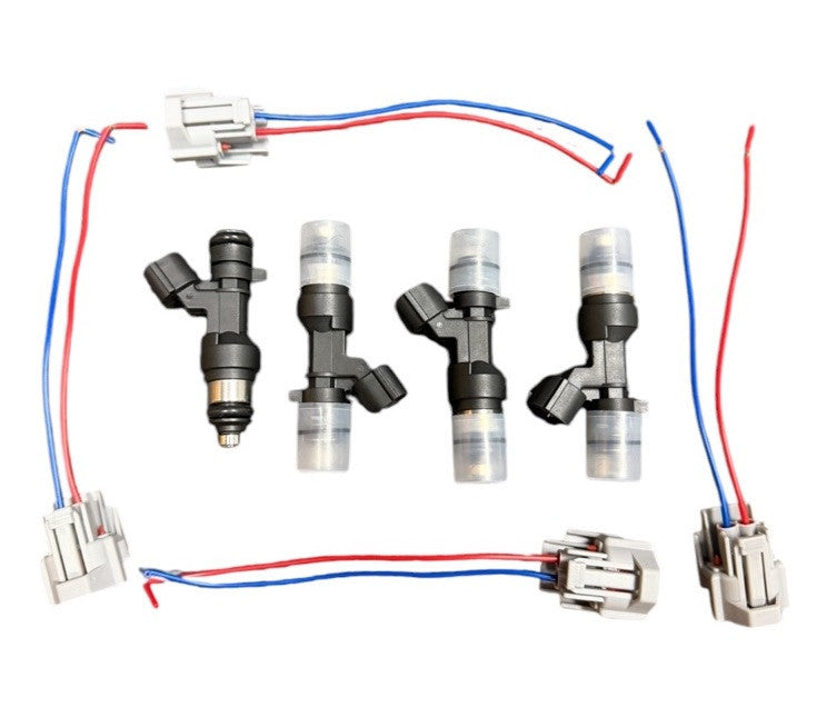 Four JackSpania Racing flow-matched 1200cc fuel injectors for B and H series engines, detailed view of injectors on a white background.