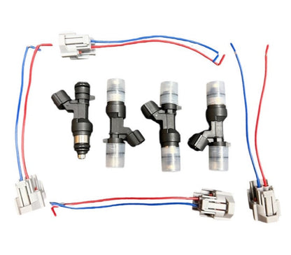 Four JackSpania Racing flow-matched 1200cc fuel injectors for B and H series engines, detailed view of injectors on a white background.