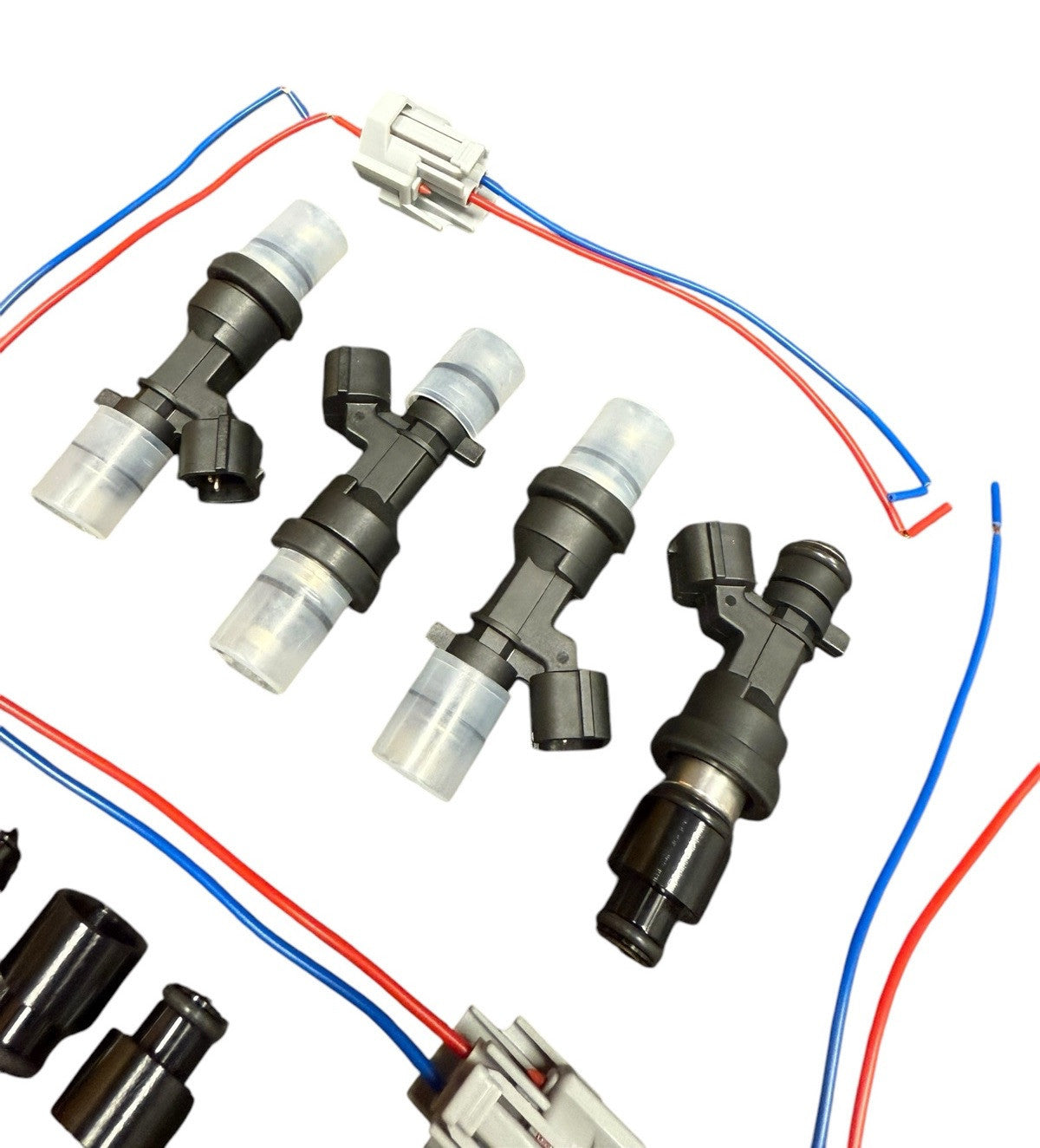 Set of 4 JackSpania Racing flow-matched 1200cc fuel injectors for B or H series engines, showing the injectors with connectors and nozzles.