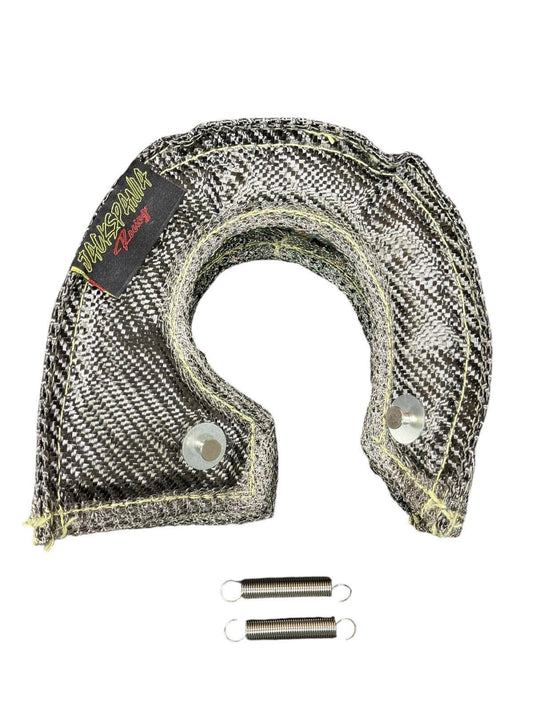 JackSpania Racing T3 Carbon Fiber Turbo Blanket heat shield barrier wrapping around a turbocharger in an engine bay.