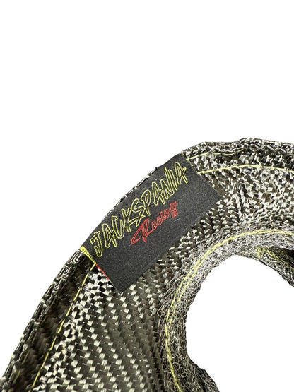 JackSpania Racing T3 Carbon Fiber Turbo Blanket heat shield barrier wrapped around a turbocharger for engine protection.