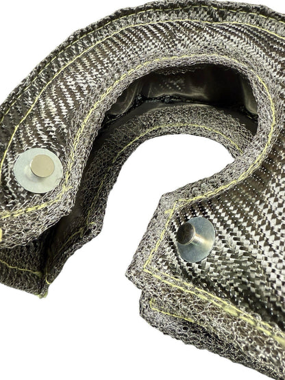 JackSpania Racing T3 Carbon Fiber Turbo Blanket heat shield barrier wrapping around turbocharger in an engine bay