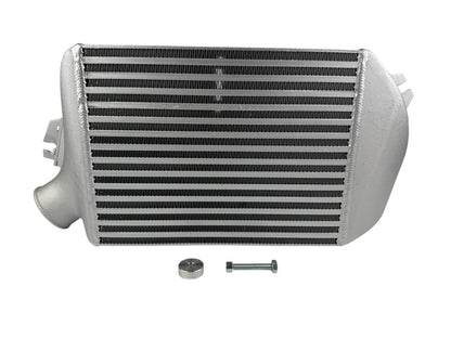 JackSpania Racing top mount intercooler for Subaru WRX, Legacy GT, and Forester 2.0L Turbo engine parts, shown installed on engine.