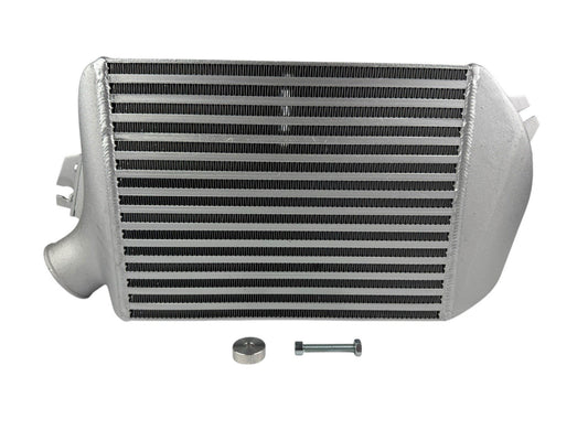 JackSpania Racing top mount intercooler for Subaru WRX, Legacy GT, and Forester 2.0L Turbo engine parts, shown installed on engine.