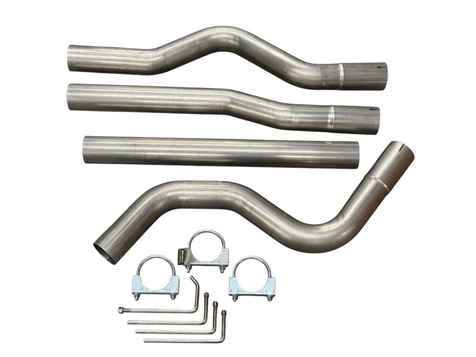 3-inch mandrel bent exhaust piping for Honda Civic EG EK DC2 by JackSpania Racing, showing smooth curved metal tubing for performance upgrade.