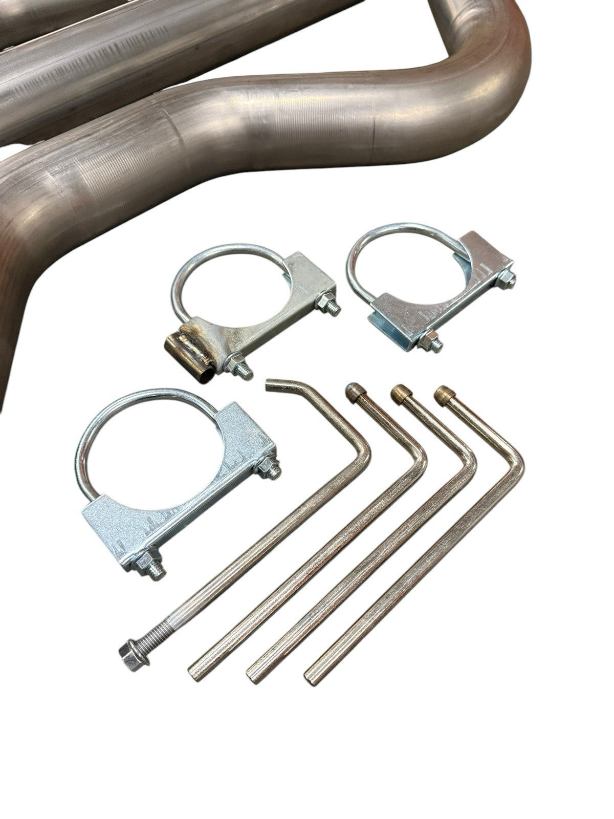 3-inch mandrel bent exhaust piping for Honda Civic EG EK DC2 by JackSpania Racing, showing smooth bends and polished metal finish.