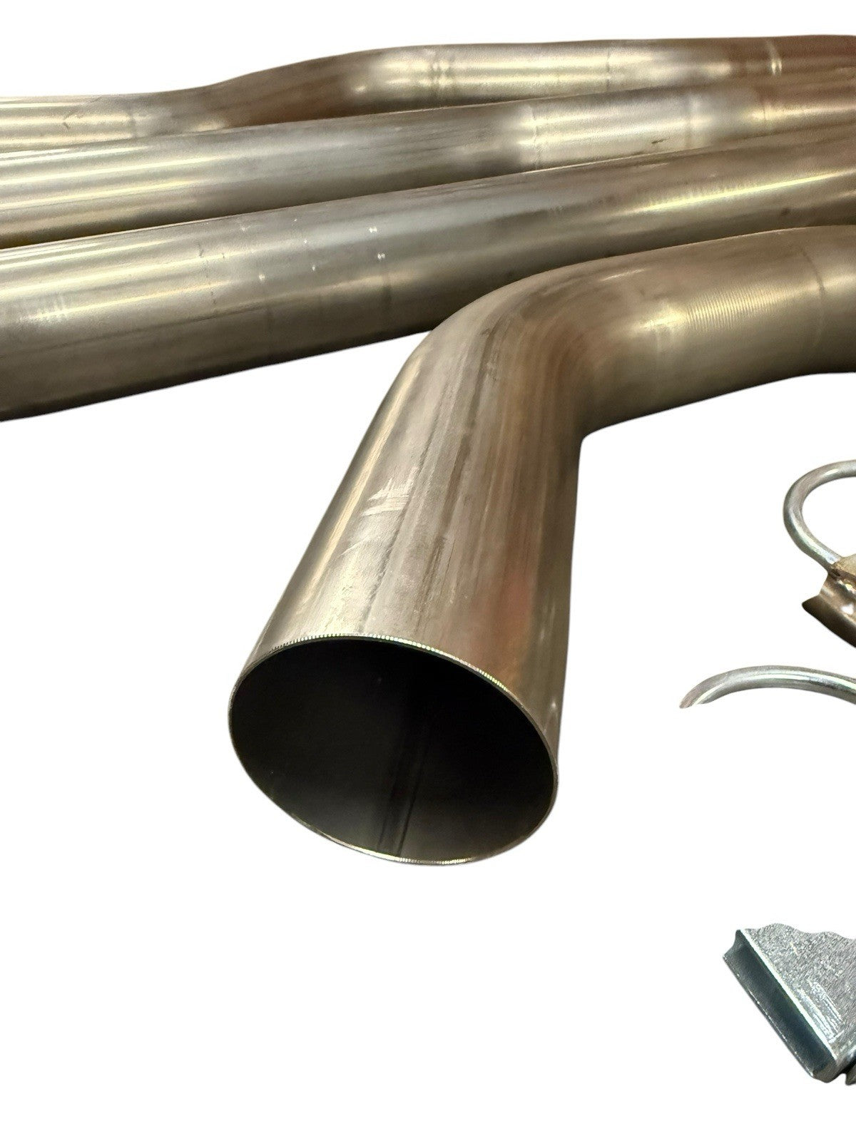 3-inch mandrel bent exhaust piping from JackSpania Racing for Honda Civic EG EK DC2, showing smooth curves and polished metal finish.