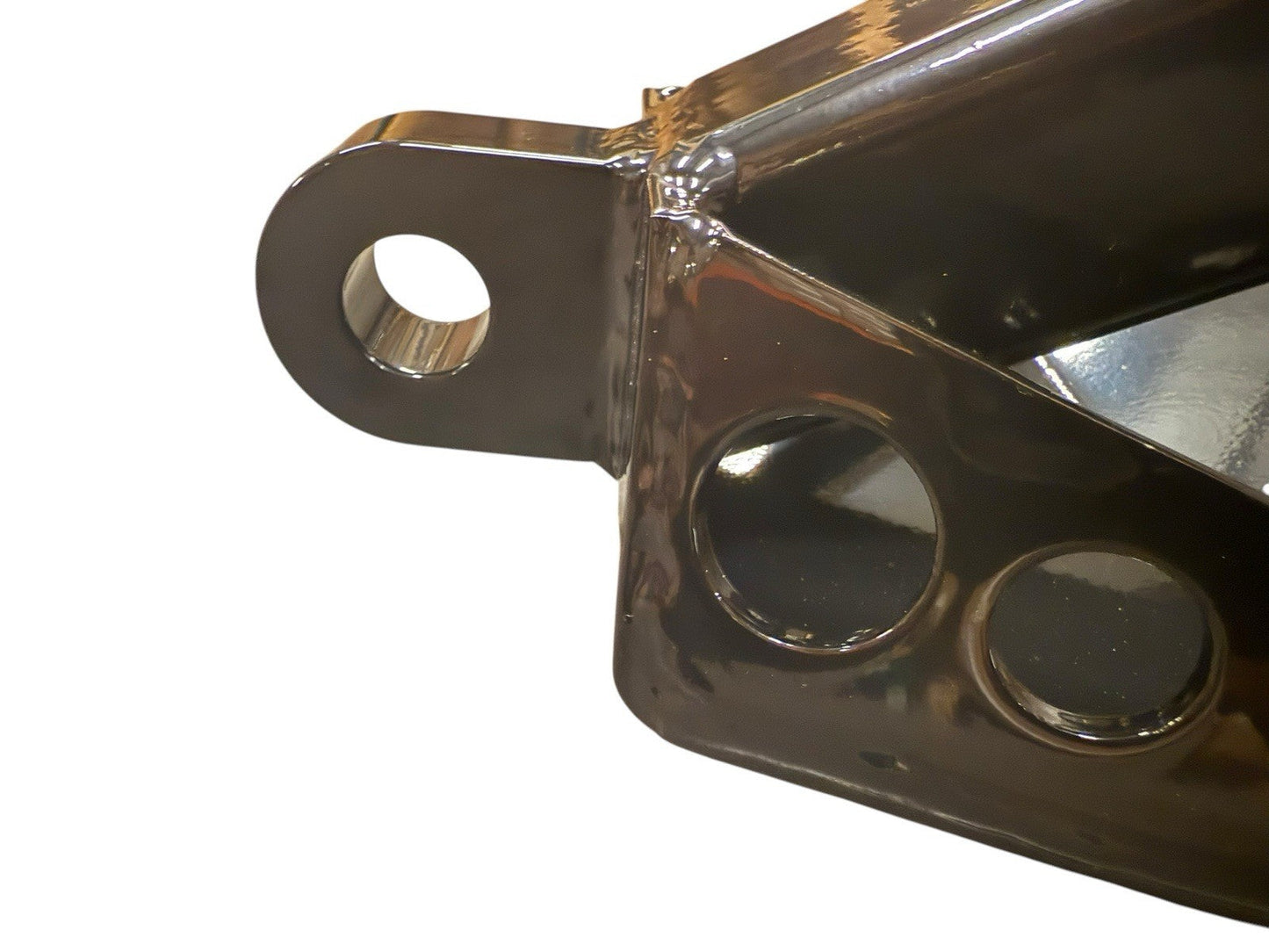 Universal 2-inch hitch skid plate by JackSpania Racing installed on a Jeep or truck, protecting the engine underside.