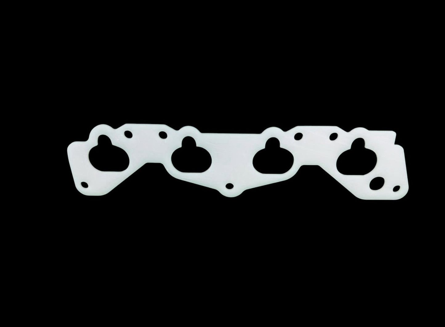 JackSpania Racing thermal intake manifold gasket for Honda Civic D15 D16 D Series engine, visible with black rubber and metal components.