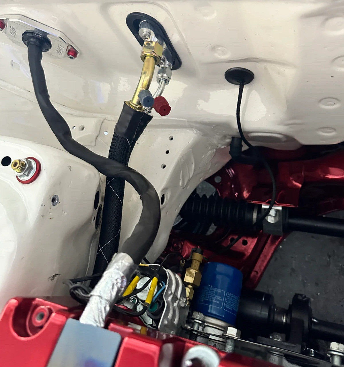 JackSpania Racing K Series K20 K24 AC line tuck kit installed in a Honda Acura Civic Type R K Swap engine compartment.