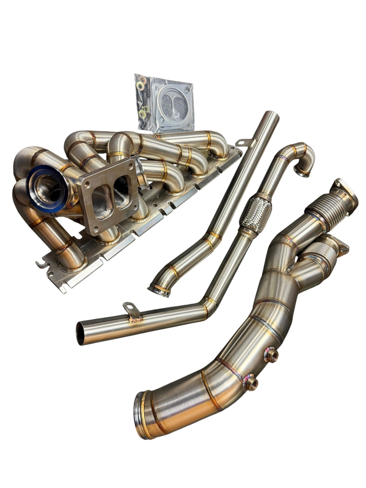 BMW S58 G80 G82 G83 G87 single turbo manifold hot-side kit by JackSpania Racing, showing metallic turbo manifold components.
