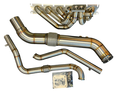 JackSpania Racing B58 Gen 2 6-port turbo hot-side kit installed on BMW M240i and Toyota GR Supra, showcasing turbo piping and fittings.