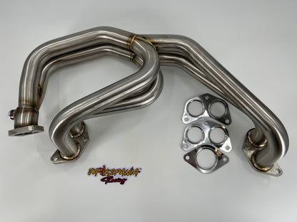 Subaru WRX and STi EJ25 equal length exhaust manifold header by JackSpania Racing, showcasing polished metal construction and inlet ports.