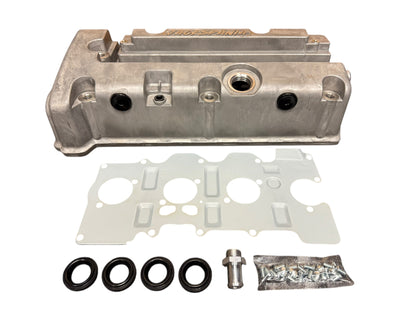 Cast aluminum K Series vented valve cover baffle with AN10 fittings for Honda Acura K20 and K24 engines, by Jack Spania Racing.