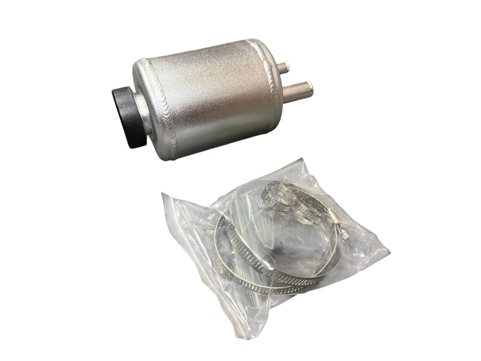 Jack Spania Racing billet aluminum power steering tank reservoir with cap, universal suspension part, shown with mounting hardware.