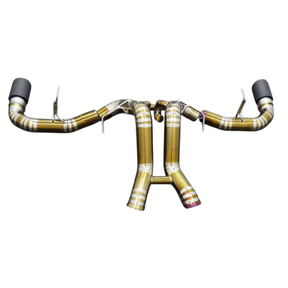 JackSpania Racing titanium exhaust system for McLaren 570S, 620R, 540C F1 race car with polished metal finish and detailed pipe design.