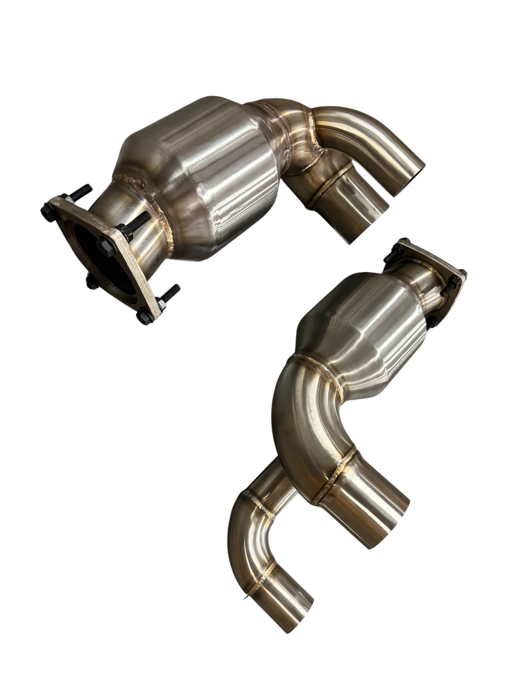 JackSpania Racing Porsche 991.2 Carrera exhaust parts with PSE Sport Exhaust Cat Bypass Pipes, showing polished metal components.