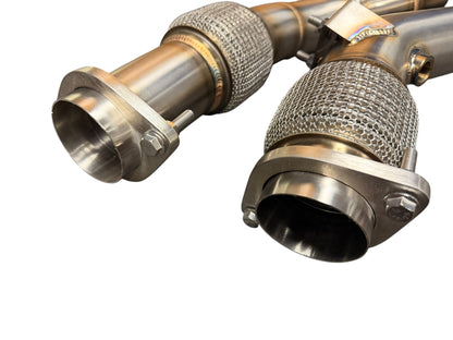 JackSpania Racing exhaust downpipe for 2019+ BMW F97 X3M and F98 X4M with S58 3.0T engine, showing the metal pipe and flange.
