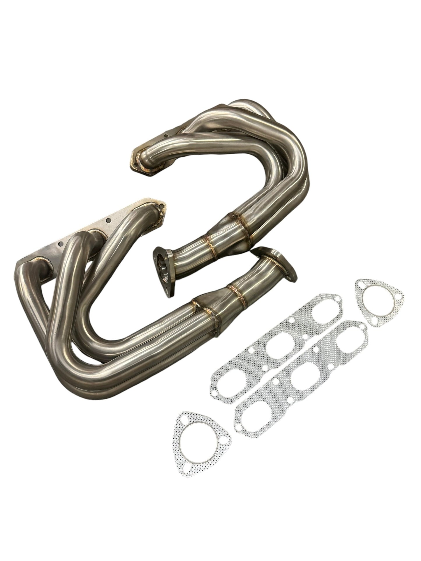 JackSpania Racing exhaust headers for Porsche 911 Carrera S 996 997.1, 1998-2008, showing polished metal and inlet ports.