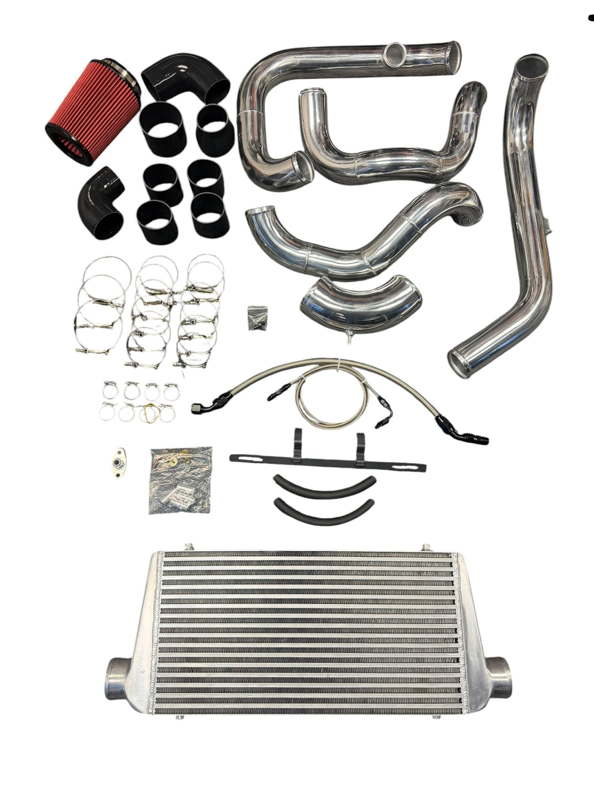 Heavy-duty JackSpania Racing turbo cold-side intercooler piping kit for 1999–2013 Silverado Sierra LS engine, with polished metal pipes.