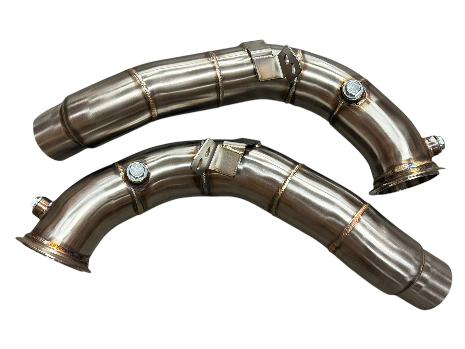 JackSpania Racing racing downpipes for BMW M5 and M6 S63 2011-2018, showing polished stainless steel exhaust pipes with mounting brackets.