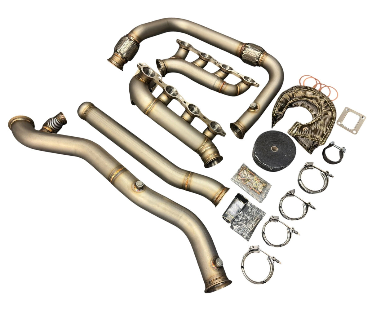 Heavy-duty JackSpania Racing turbo kit for Chevy Silverado and GMC Sierra LS models, includes exhaust components and piping.