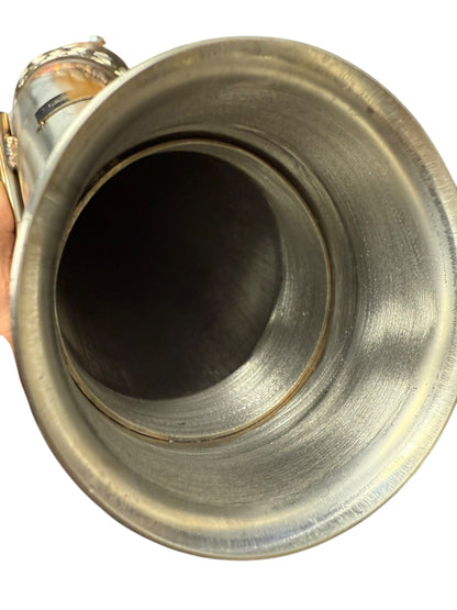 Ford Focus RS high flow catted downpipe exhaust part by JackSpania Racing, showing the polished metal pipe with flanges and catalytic converter
