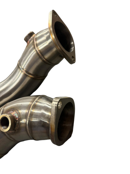 Stainless steel exhaust downpipe for BMW N54 135i 335i E90 E92, 3-inch diameter, by JackSpania Racing, showing the pipe's polished surface.