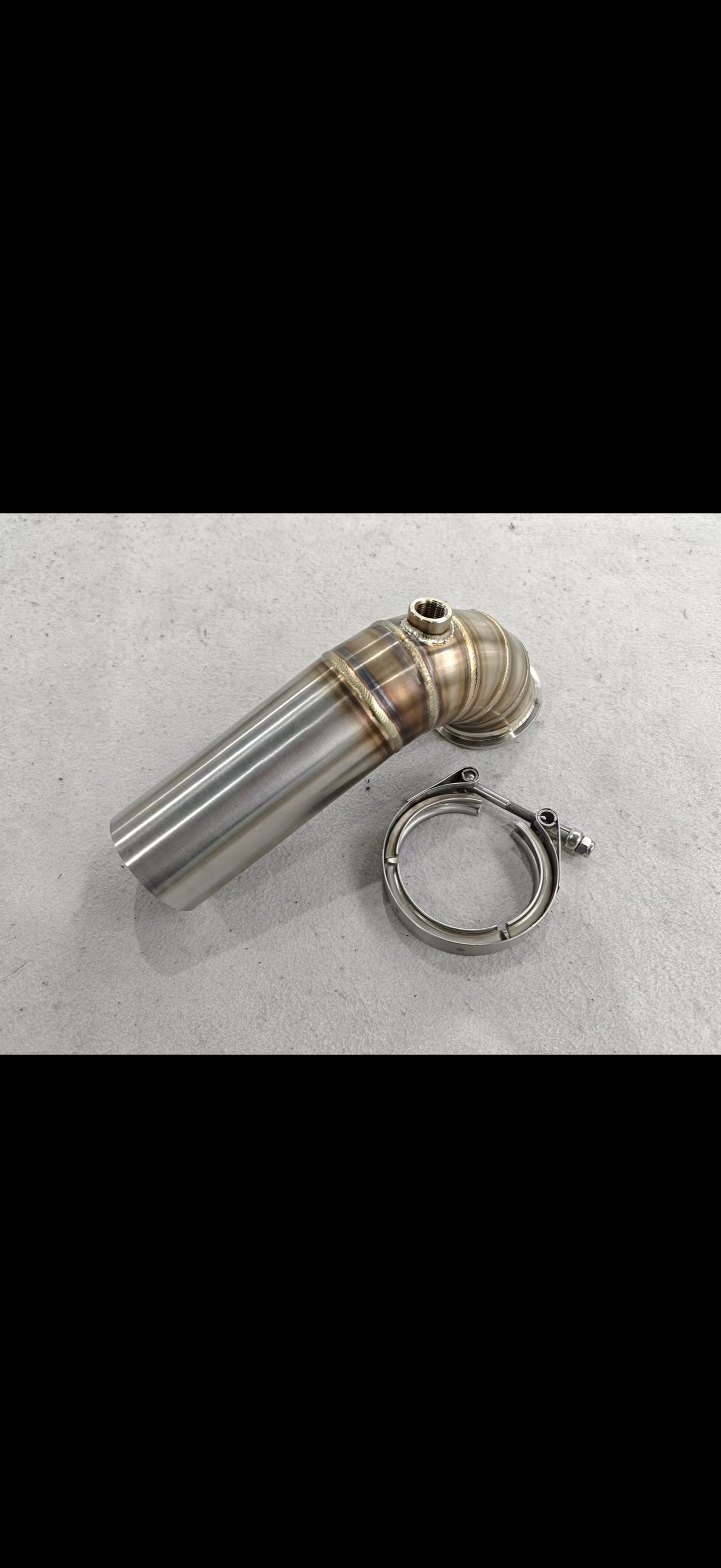 JackSpania Racing 3-inch downpipe with V-band turbo flange, exhaust pipe, and O2 bung for high-performance turbo systems.