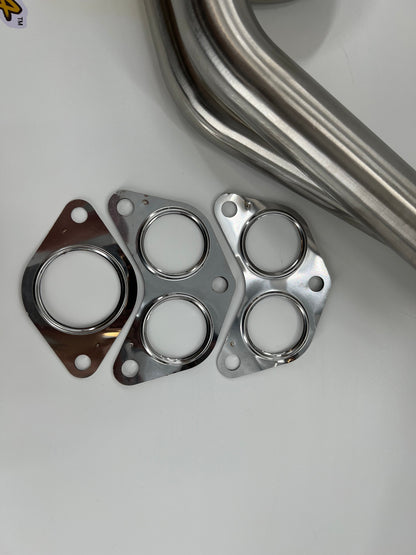 Subaru WRX and STi EJ25 equal length exhaust manifold header by JackSpania Racing, showing polished metal construction.