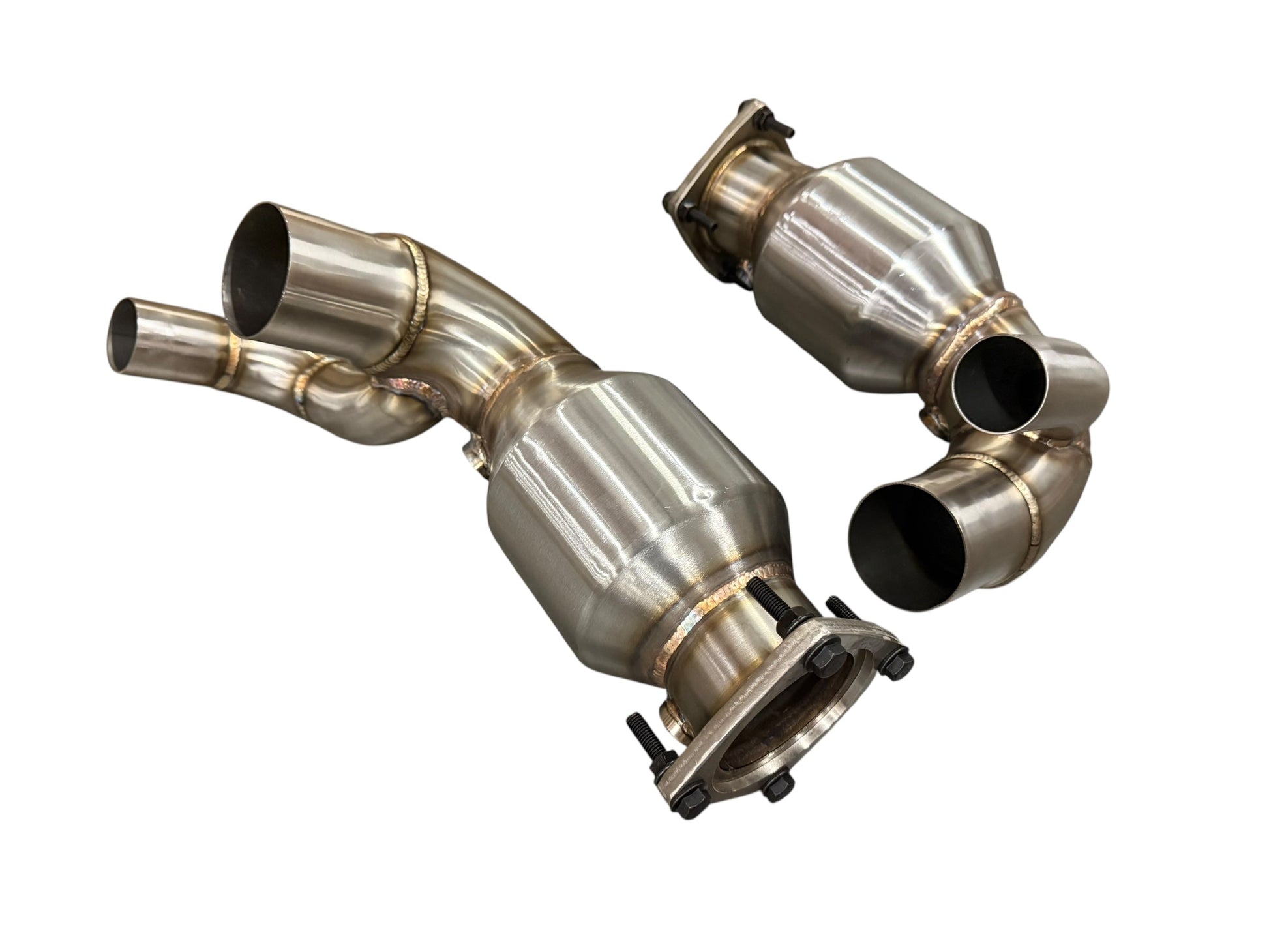 JackSpania Racing Porsche 991.2 Carrera exhaust parts with PSE Sport Exhaust Cat Bypass Pipes, showing polished metal components.