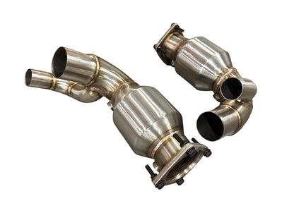 JackSpania Racing Porsche 991.2 Carrera exhaust parts with PSE Sport Exhaust Cat Bypass Pipes, showing polished metal components.