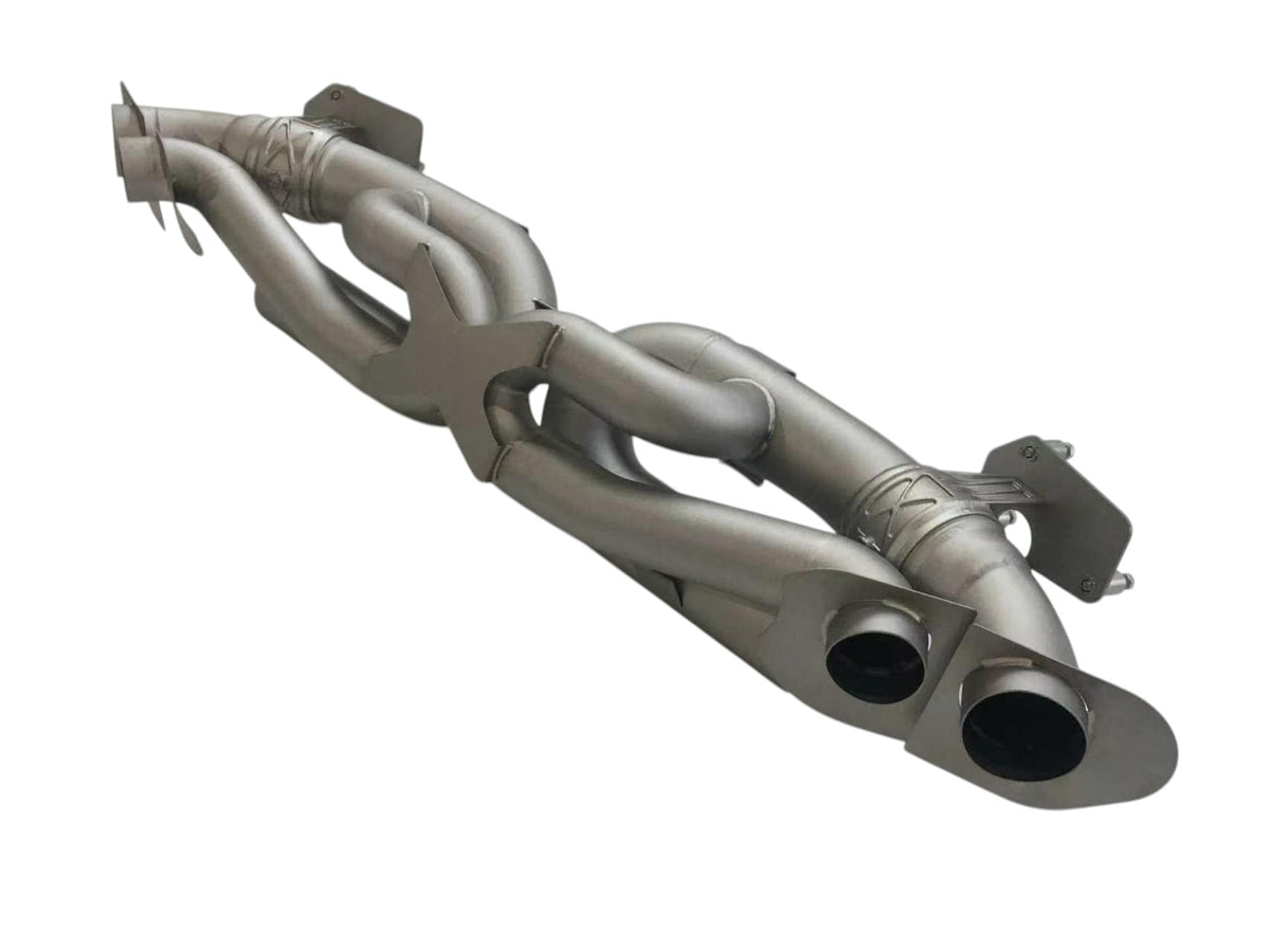 Titanium valved sport exhaust system for Porsche 992 Carrera Turbo by JackSpania Racing, showing polished exhaust pipes and valves.