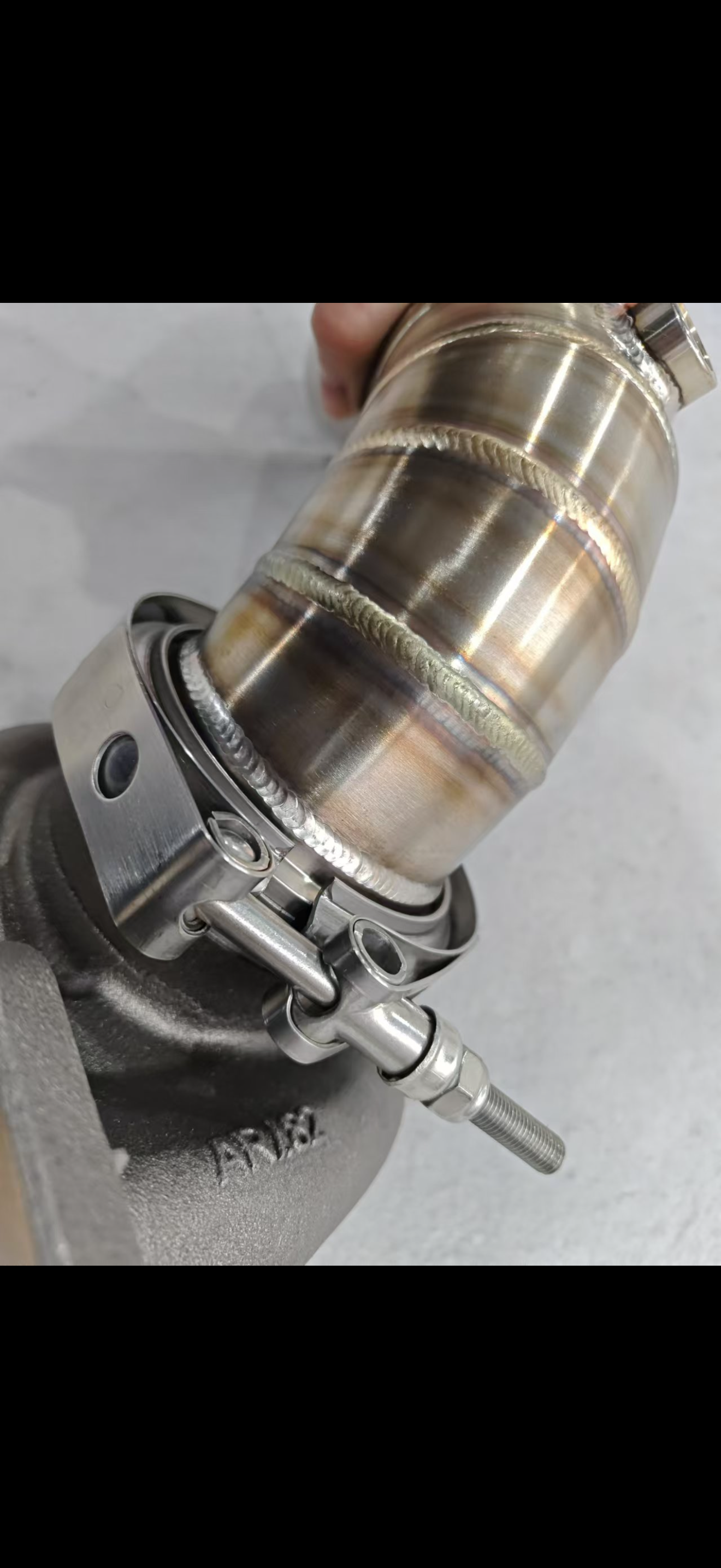 JackSpania Racing 3-inch downpipe with V-band turbo flange, exhaust pipe, and O2 bung for Garrett Holset and BorgWarner turbos.