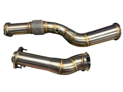 High flow non-catted BMW S58 M2 G80 M3 G82 M4 G87 M2 downpipes by JackSpania Racing, showcasing shiny stainless steel exhaust parts.