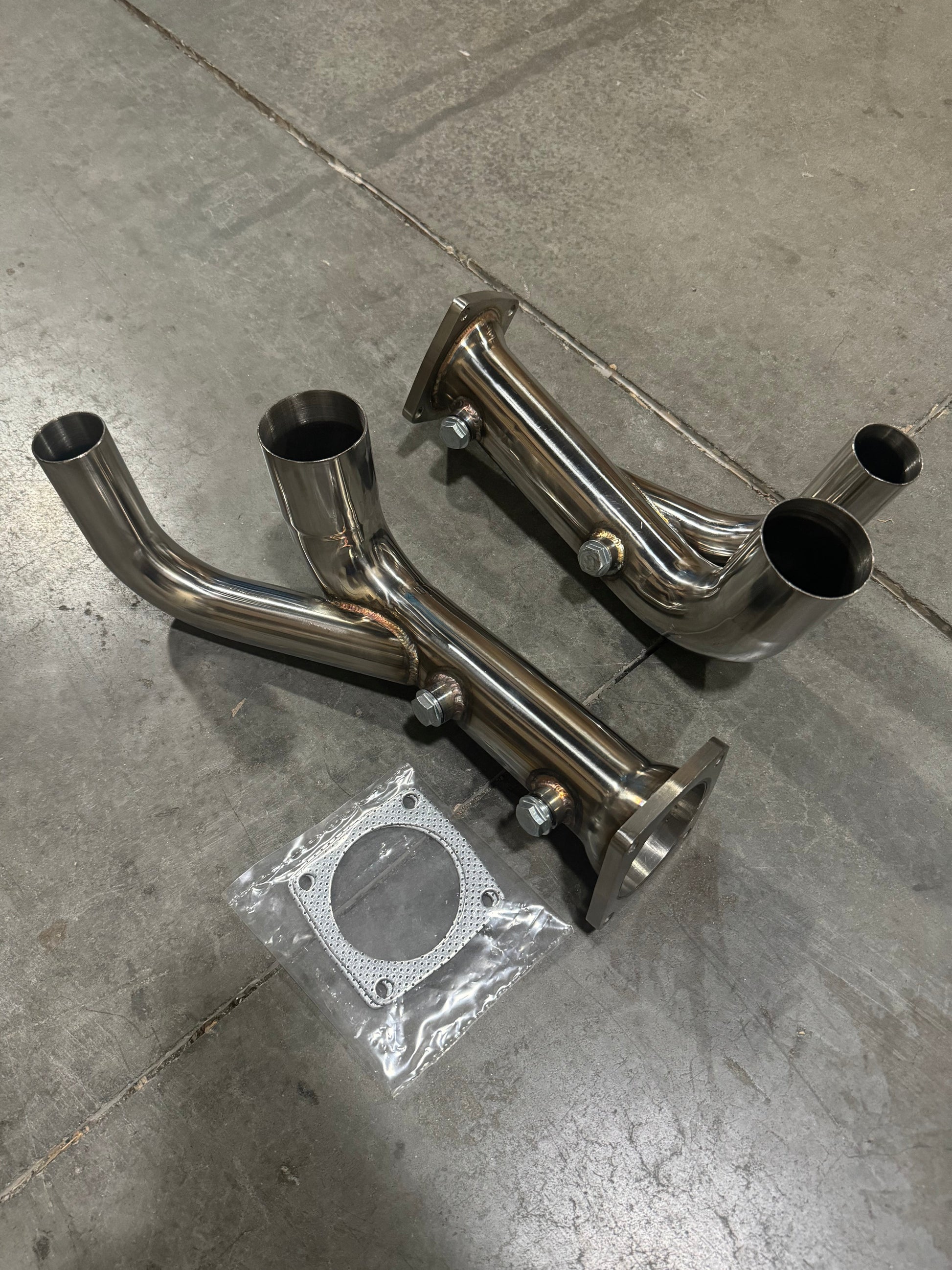 Porsche 991.2 Carrera JackSpania Racing PSE Sport Exhaust Cat Bypass Pipes, 2017-2019, metal exhaust parts with polished finish.