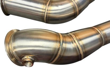 Downpipe for 2019+ BMW F97 X3M and F98 X4M S58 3.0T exhaust parts by JackSpania Racing, showing the metal pipe and fittings.