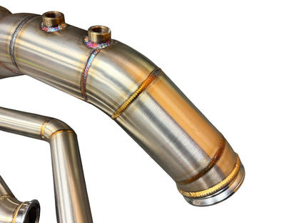 BMW S58 G80 G82 G83 G87 single turbo manifold hot-side kit by JackSpania Racing, showing polished metal turbo manifold components.
