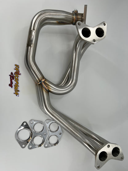 Subaru WRX and STi EJ25 equal length exhaust manifold header by JackSpania Racing, showing polished metal construction.