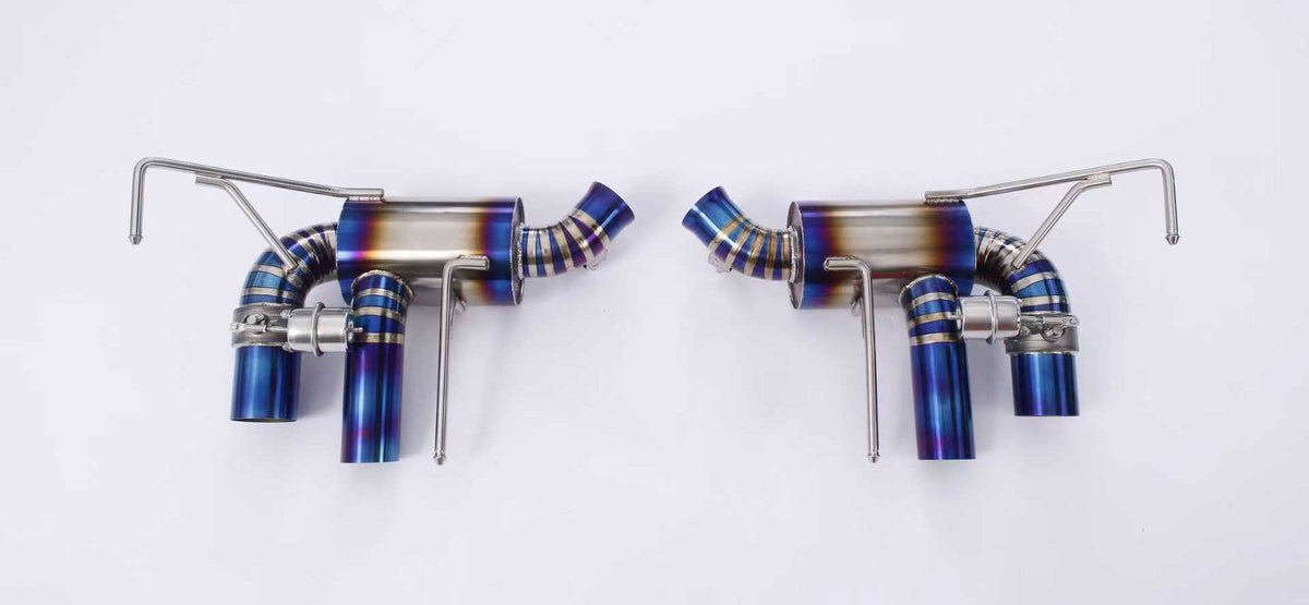 Ferrari California 4.3 V8 titanium valved exhaust system by JackSpania Racing, showing polished titanium exhaust pipes and valves.