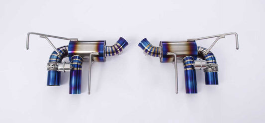 Ferrari California 4.3 V8 titanium valved exhaust system by JackSpania Racing, showing polished titanium exhaust pipes and valves.