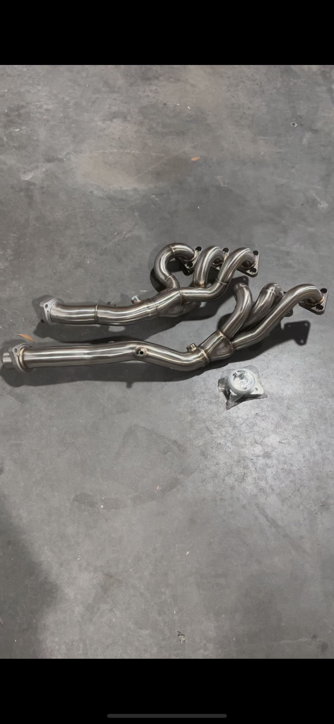 BMW E46 M3 S54 exhaust headers by JackSpania Racing, showcasing high-performance metal headers for 2001-2006 3 Series models.